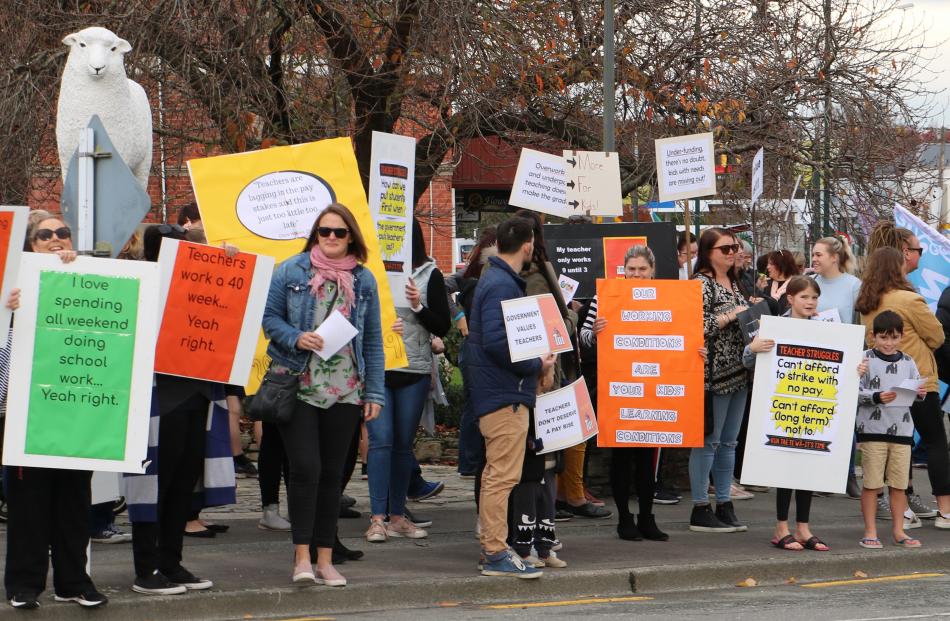 Gore: About 150 teachers and supporters - including 25 children - gather and march in Gore's Main St. Photo: Sandy Eggleston