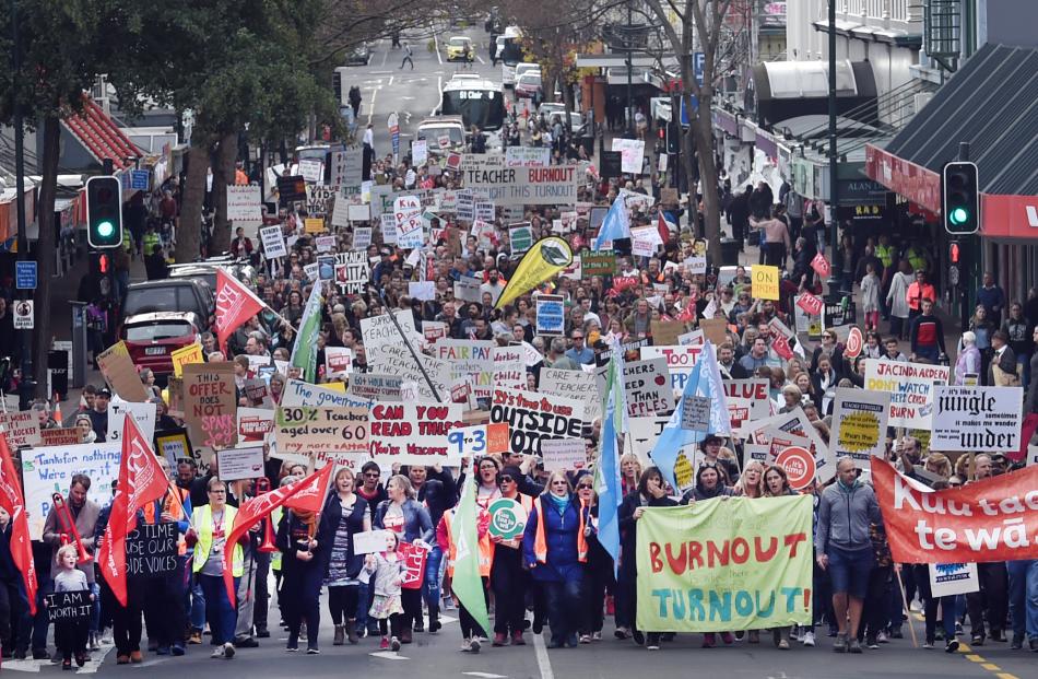 More than 2000 principals, teachers, parents and children march along George St, Dunedin, as part of the nationwide teachers' strike yesterday. Photo: Peter McIntosh