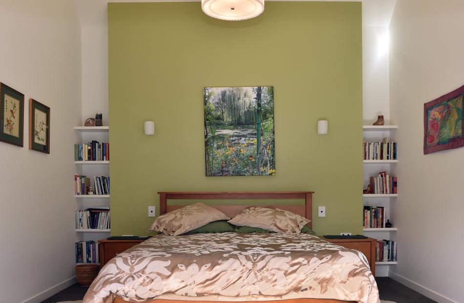 A photo Dr Hood took on her phone of Monet’s garden in Giverny, France, hangs above the bed....