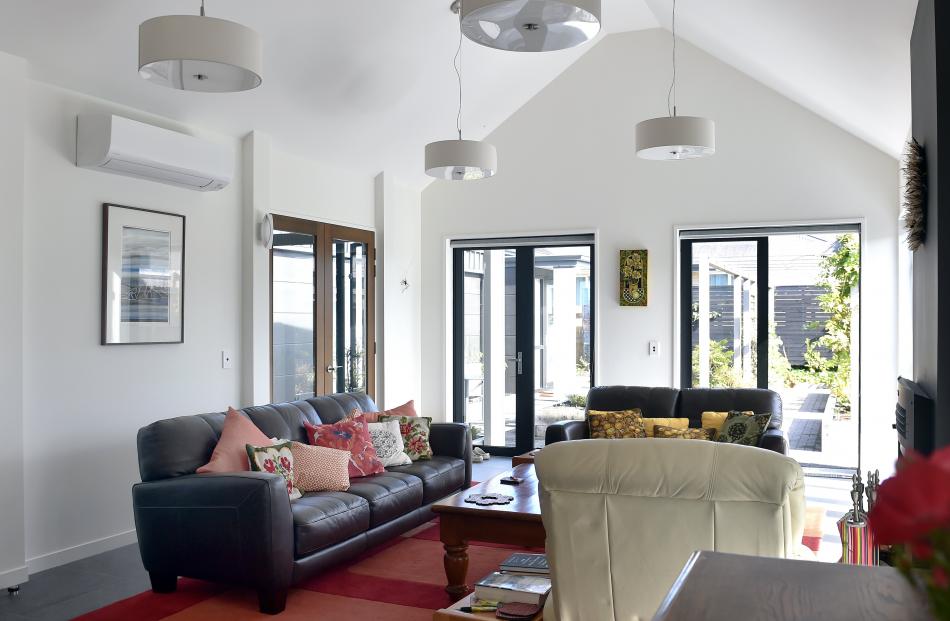 High ceilings add to the sense of space. Doors in the living area open to the atrium on one side...