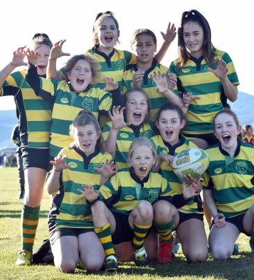 Celebrating a victory are the Green Island Grizzlies U13 girls team, winners of the girls'...