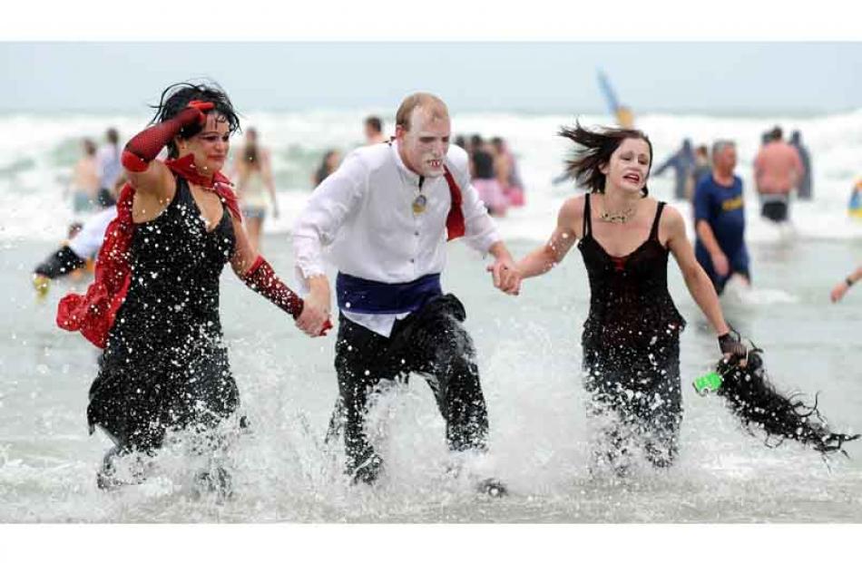 Vampires, from left, Jodi Williams (30), Daniel Bell (28), and Tash Brightwell (18) exiting the...