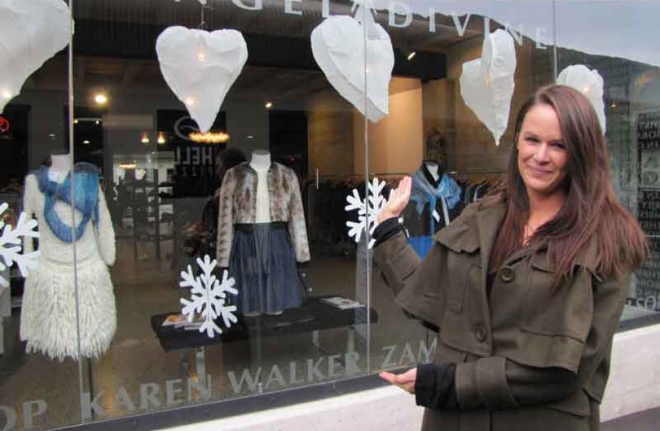Angel Divine acting manager Olivia Dunstan stands outside the five lanterns made from cheesecloth...