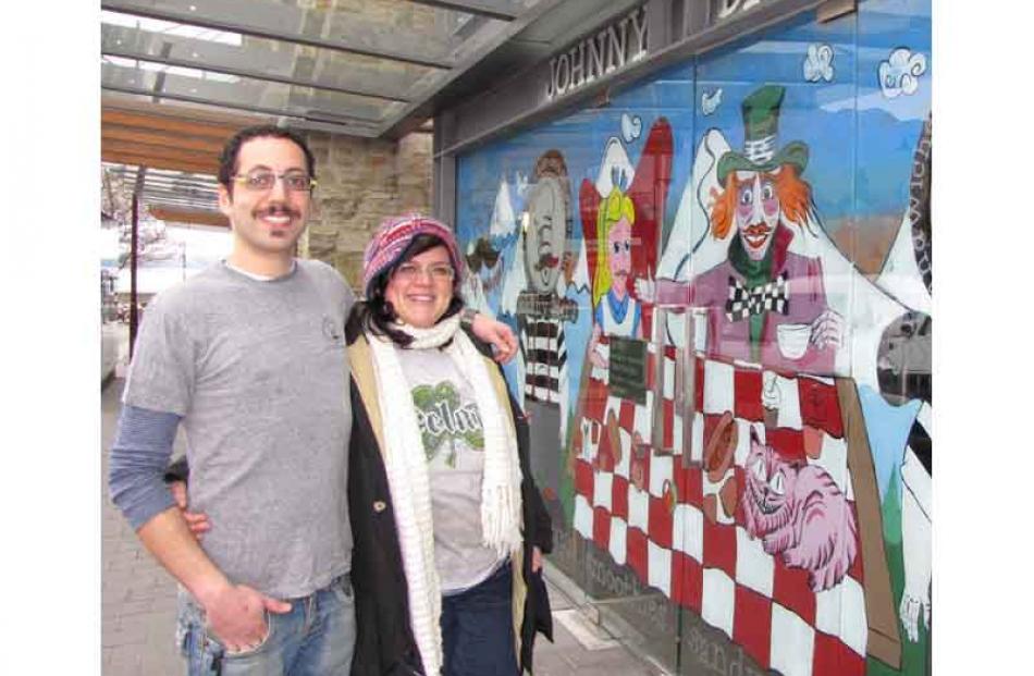 Johnny Barr's owner-director Ramy Abu-Yousef and manager Cristina Mattarella present a painting...