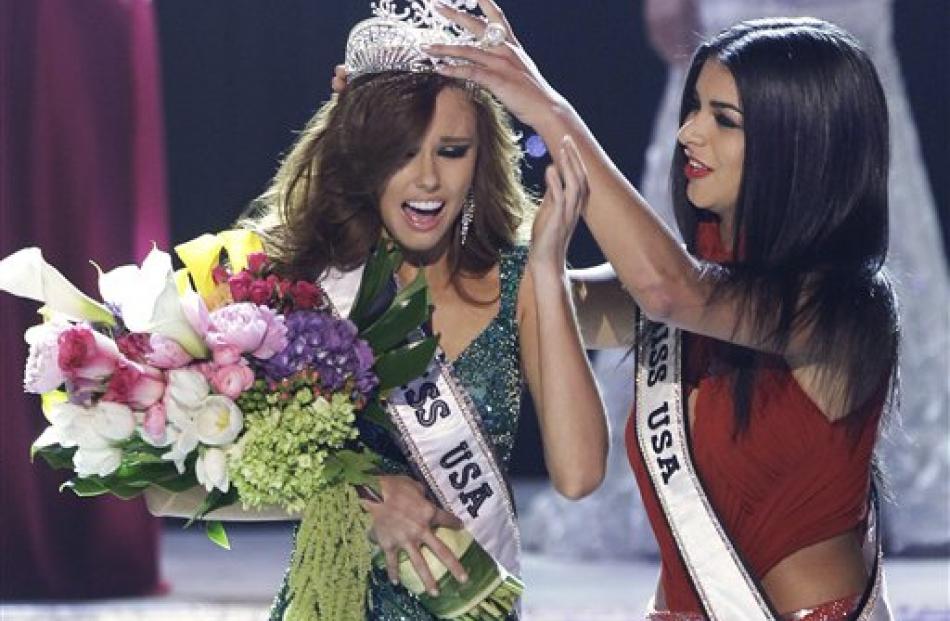 Alyssa Campanella, Miss California, is crowned as the 2011 Miss USA by Miss USA 2010 Rima Fakih,...