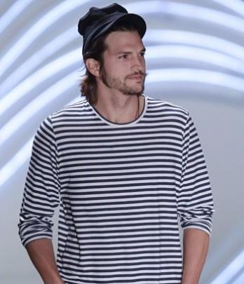 Ashton Kutcher wears a creation from the Colcci Summer 2012 collection at Sao Paulo Fashion Week...