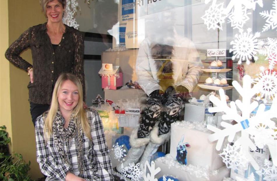 d t carter owner Tania Carter (standing) and manager and co-creative designer of the window...