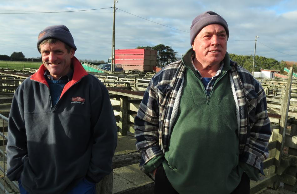 Charlie Smith, (left) of Ryal Bush Transport, chats with Eric Rowland, of Invercargill, as he...