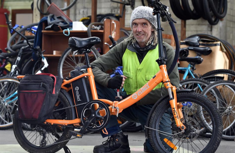 Nathan Parker prepares an electric bike for sale. 