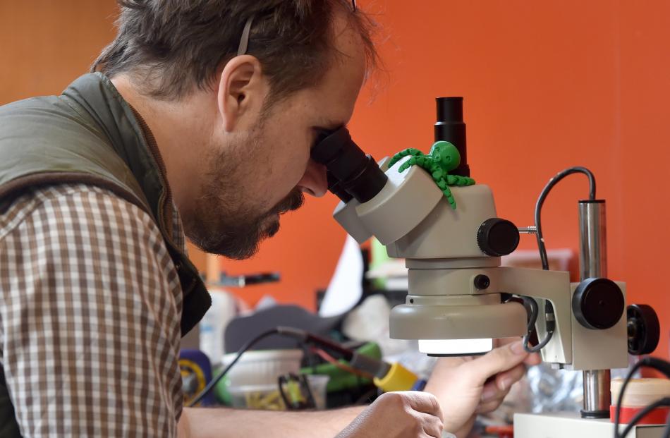 Tim Bishop works on his heat and moisture sensing electronics. 