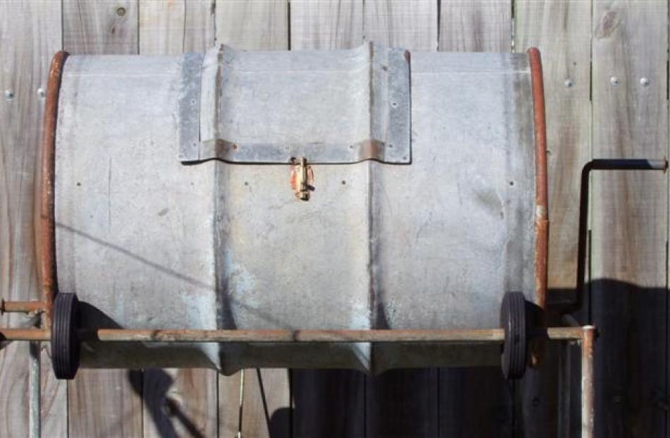 A revolving compost bin made from a 44-gallon drum.