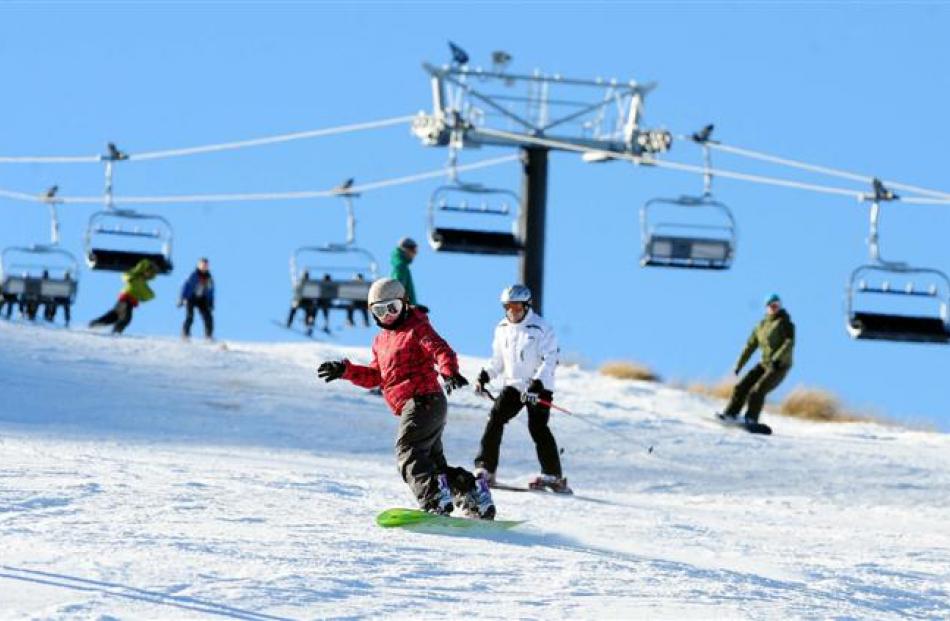 The slopes come alive as  Coronet Peak opens for the 2011 season. Photo by Craig Baxter.