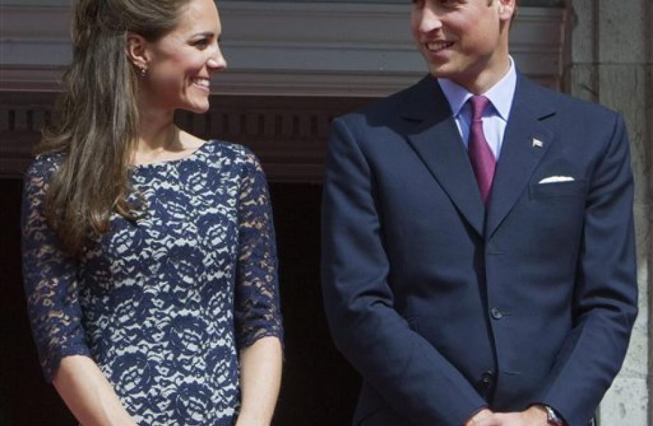 Prince William and Kate, the Duke and Duchess of Cambridge exchange a glance at Rideau Hall.