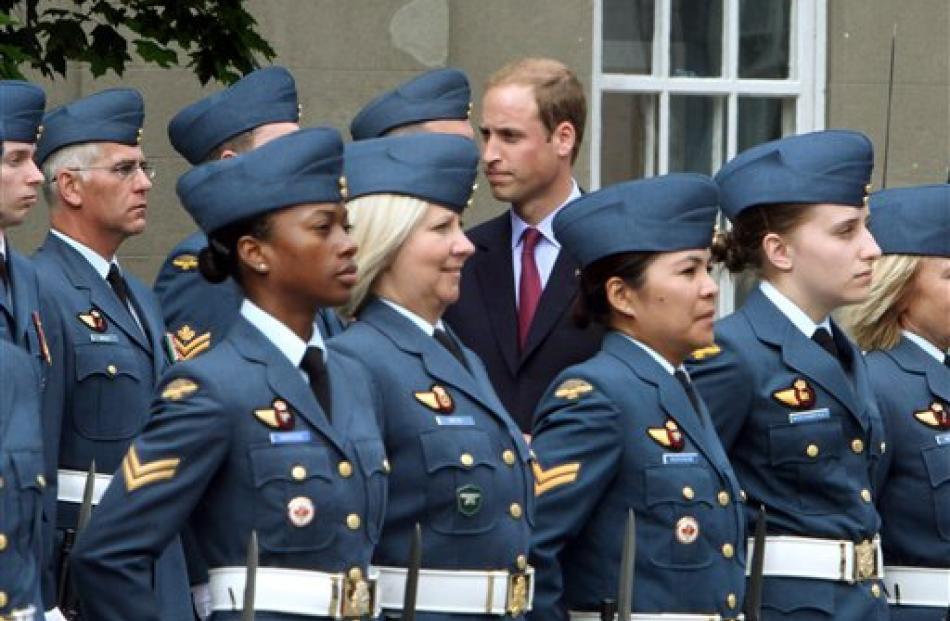 Prince William inspects a Canadian Forces guard of honour.