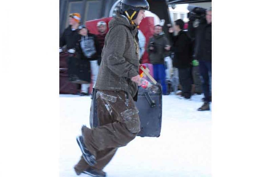 Olly Day, of Queenstown, decides to sprint the last leg of the suitcase race.