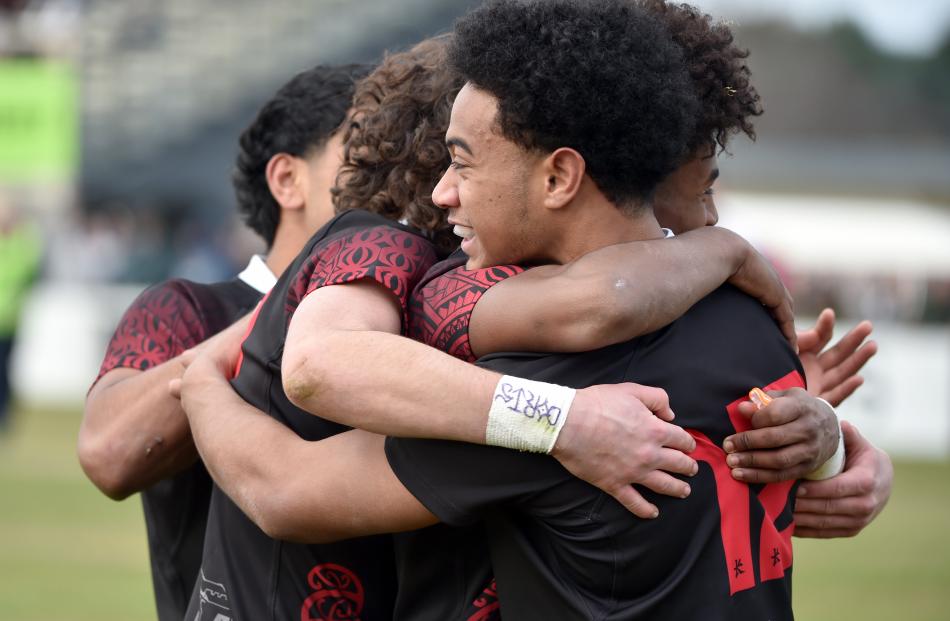 Waitaki Boys’ players celebrate after the win.