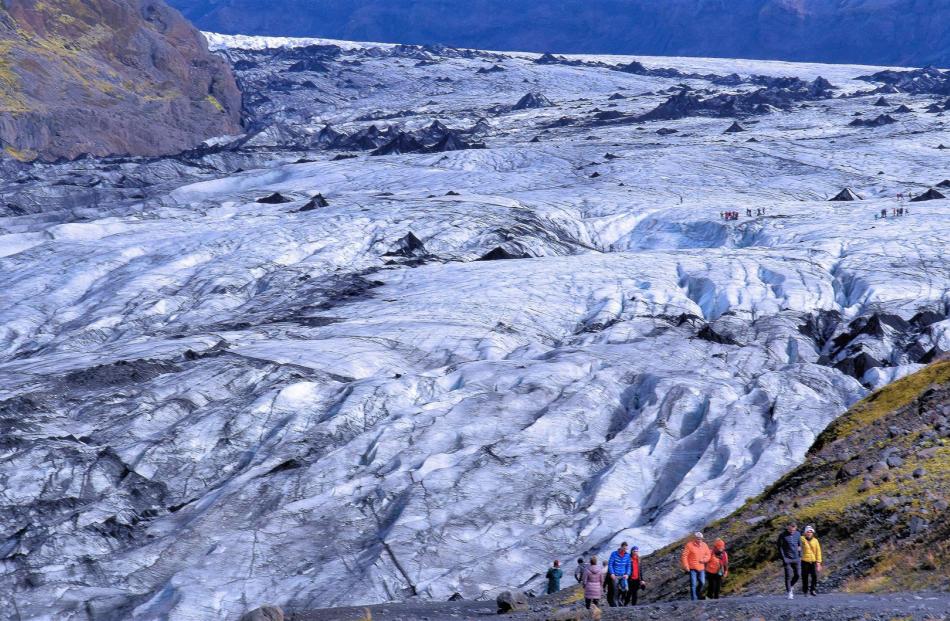 Walking to a real glacier in southern Iceland. This Myrdalsjokull glacier covers the deadly Katla...