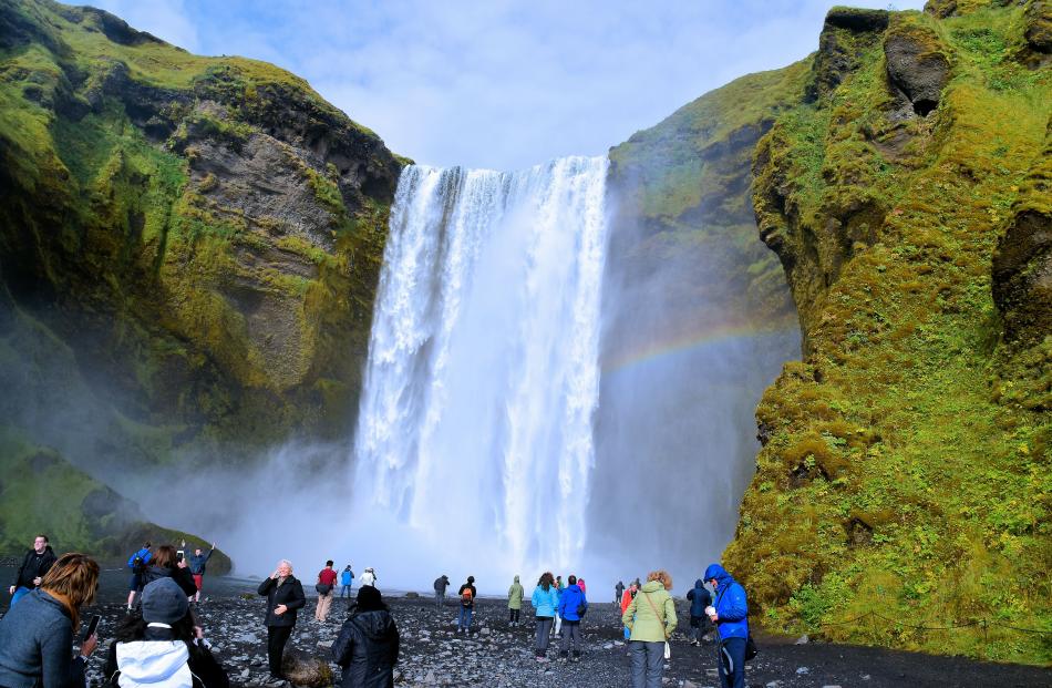 Wetting experience. Skogafoss is one of Iceland’s largest waterfalls. Folklore says in Viking...