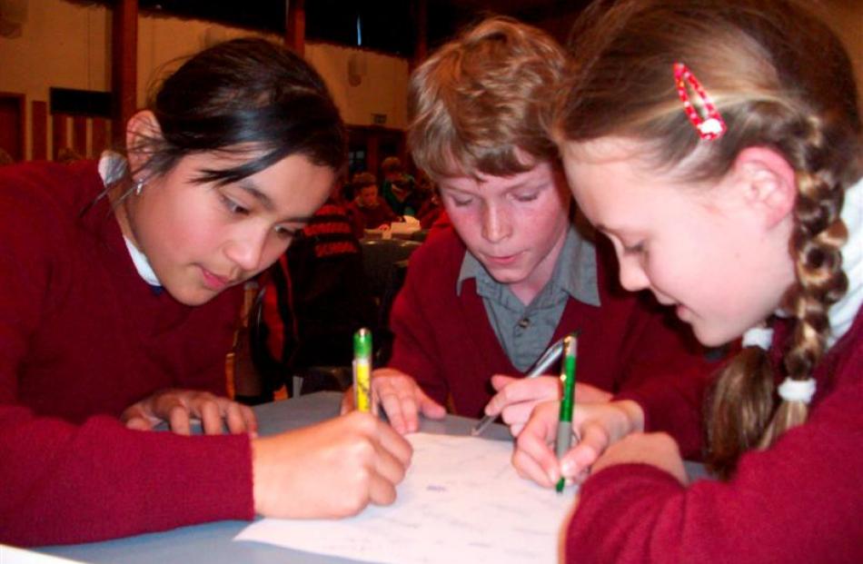 St Joseph's Primary School pupils (from left) Llewellah Priest (10), Ben Davenport (9) and...