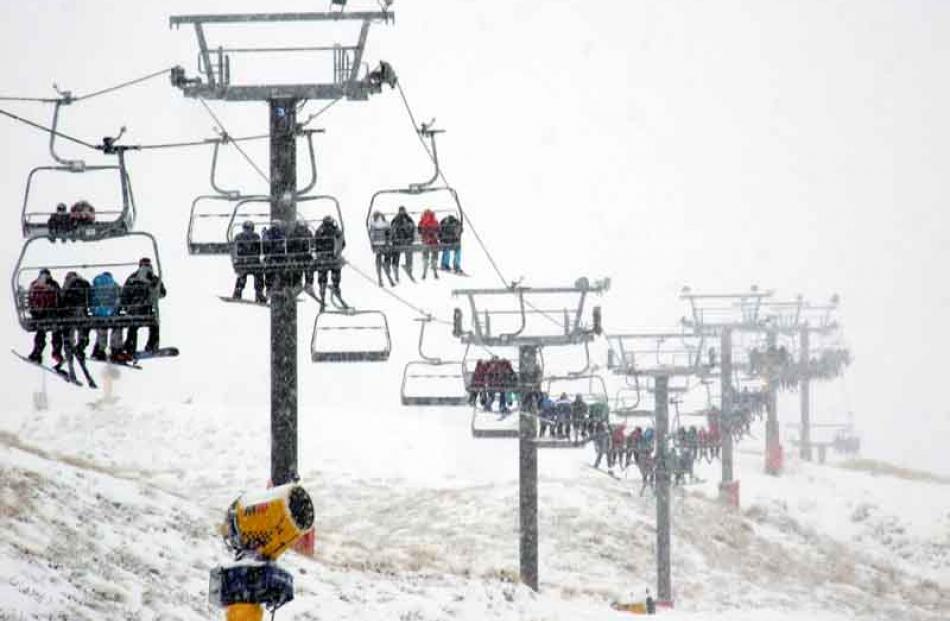 People enjoying the slopes as snow finally falls on the ski fields around Queenstown.