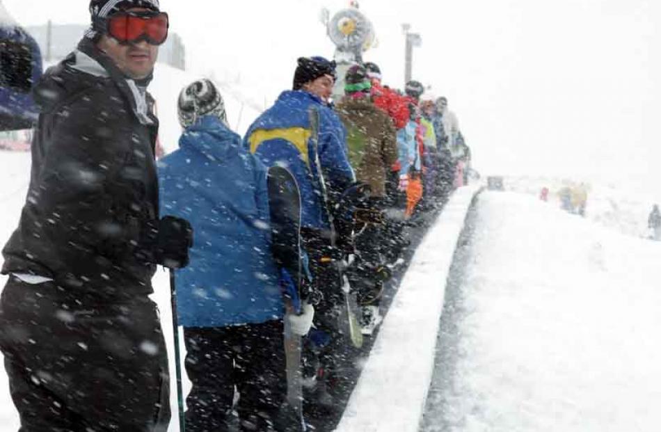 People enjoying the slopes as snow finally falls on the ski fields around Queenstown.