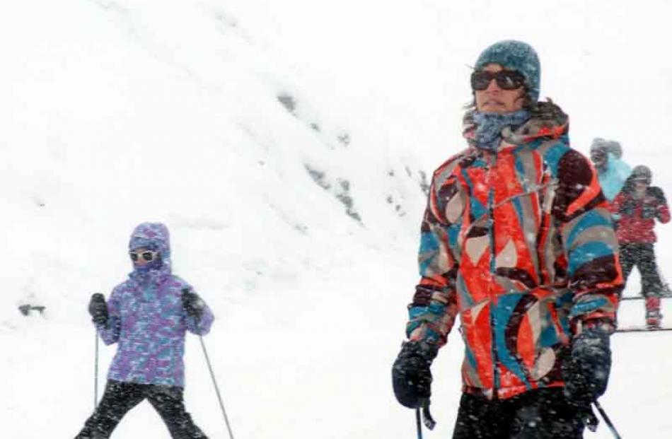 People enjoying the slopes as snow finally falls on the ski fields around Queenstown.