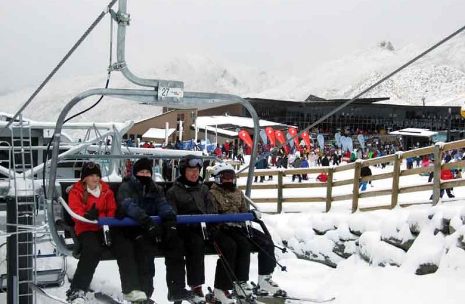 People enjoying the slopes as snow finally falls on the ski fields around Queenstown.