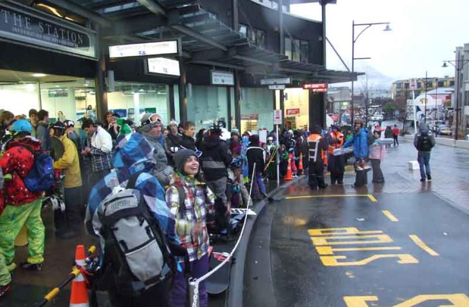 Snow suspense... Hundreds of keen skiers and snowboarders queue outside NZSki's snow centre...