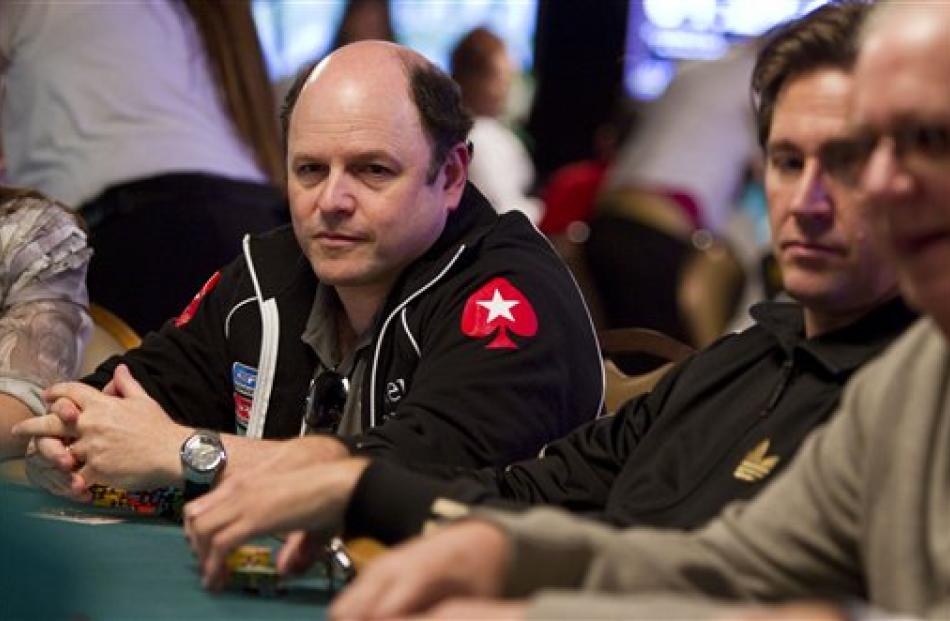 American actor Jason Alexander, left, competes on the first day of the World Series of Poker at...
