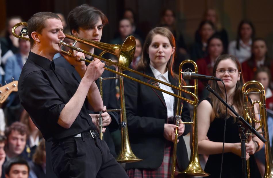 Logan Park High School pupil Finn McKinlay performs a trombone solo.