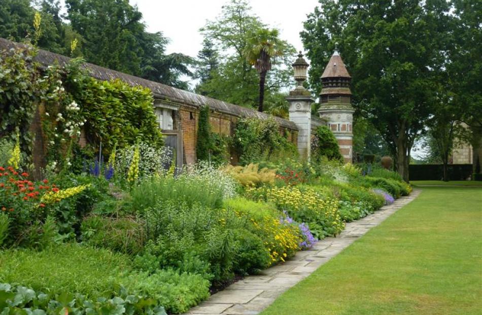 Cliveden's herbaceous border and impressive dovecote. Photo by Kerri Brennan.