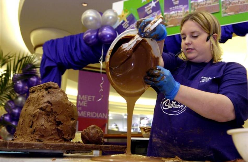 Food artist Prudence Staite demonstrates her chocolate food art at the Meridian Mall on Saturday....