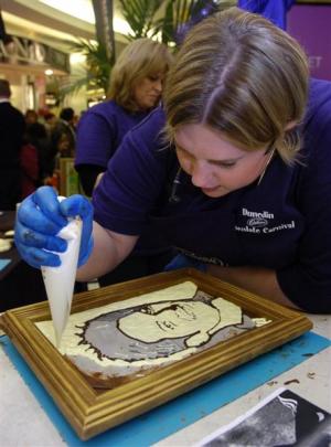 Food artist Prudence Staite demonstrates her chocolate food art at the Meridian Mall on Saturday....