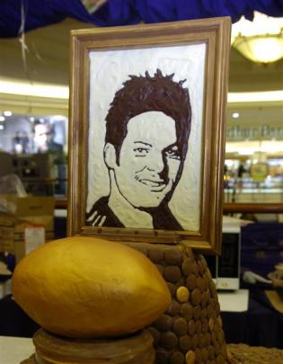 Food artist Prudence Staite demonstrates her chocolate food art at the Meridian Mall on Saturday....