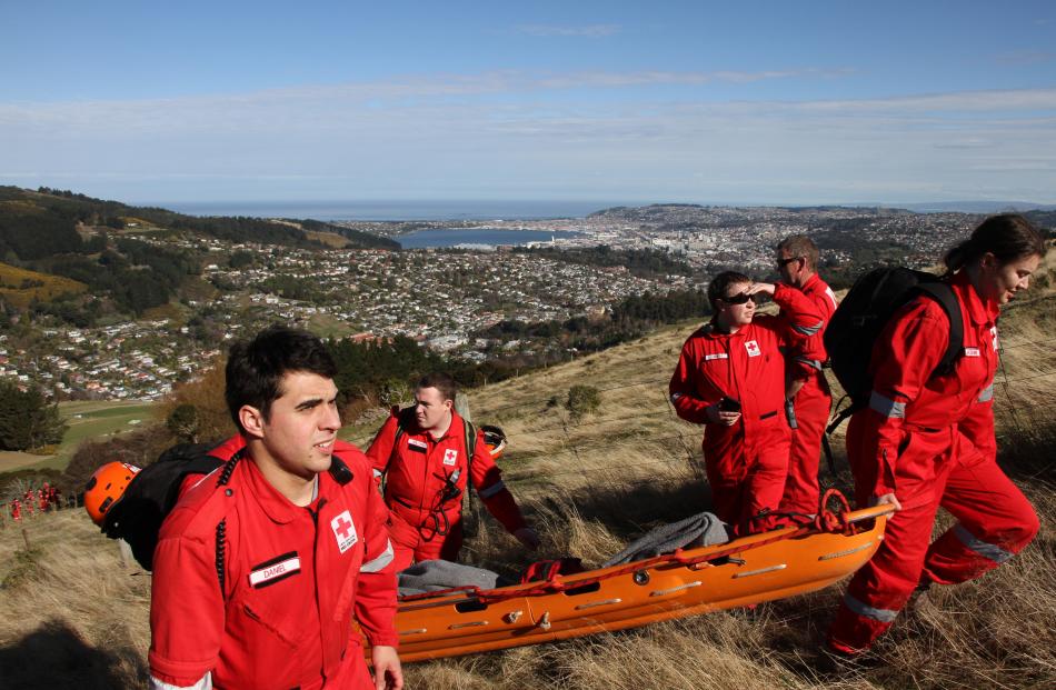 Dunedin Red Cross search teams look for survivors of a notional plane crash in the hills above...