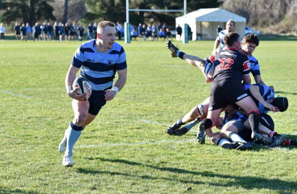 Halfback Harry Kirk finds a gap. Photo: Karen Casey.