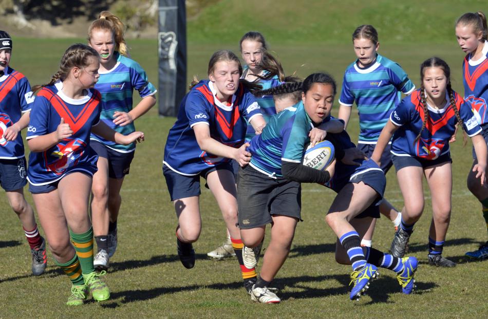 Blandina Veituna (11), of Tahuna Normal Intermediate looks to run through the Balmacewen...