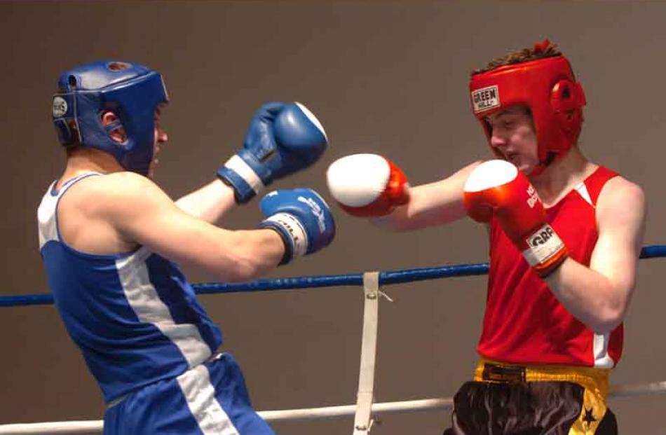 Dema Dyshlav of the Papanui Club, Christchurch, left, fights Keegan Bain, right of Rowes club in...