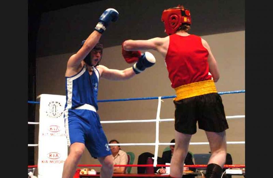 Dema Dyshlav of the Papanui Club, Christchurch, left, fights Keegan Bain, right of Rowes club in...