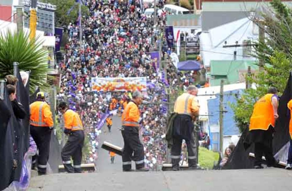 Left-behind jaffas are cleaned up at the annual Cadbury Jaffa Race, held on Friday at Dunedin's...