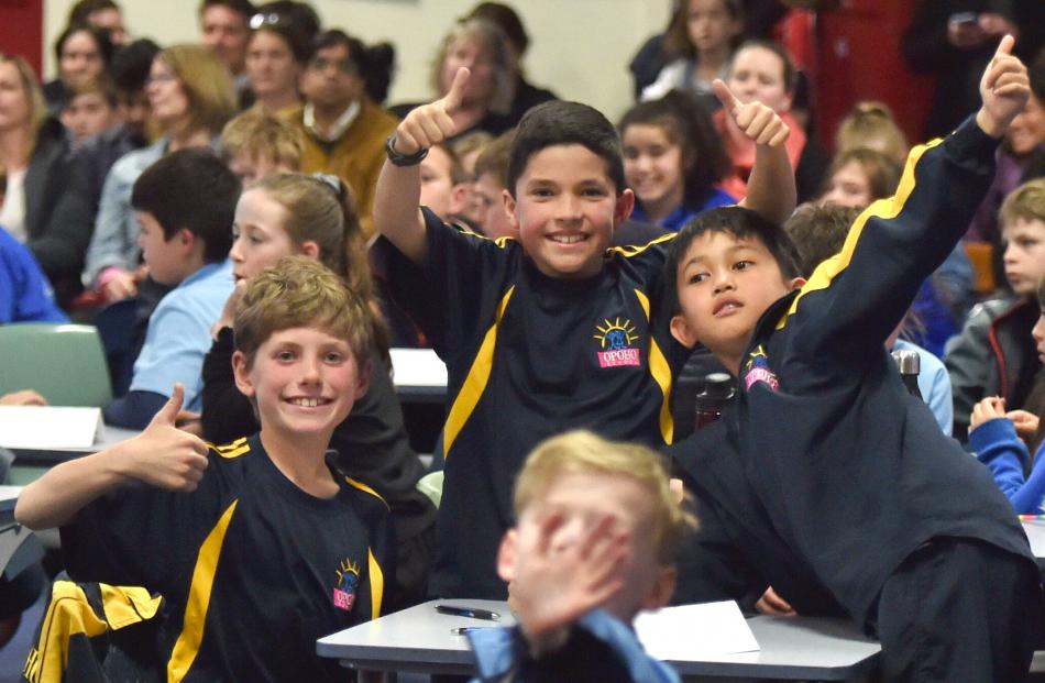 Relaxing between questions are Opoho School pupils (from left) Lewis Marr (10), Kura Stevens (10)...