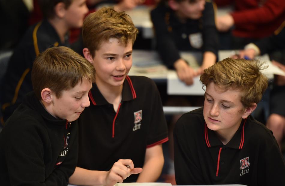 Dunedin North Intermediate pupils Tom Hayman (12), Jack Aubin (12) and Rocky Allan (12) use their...