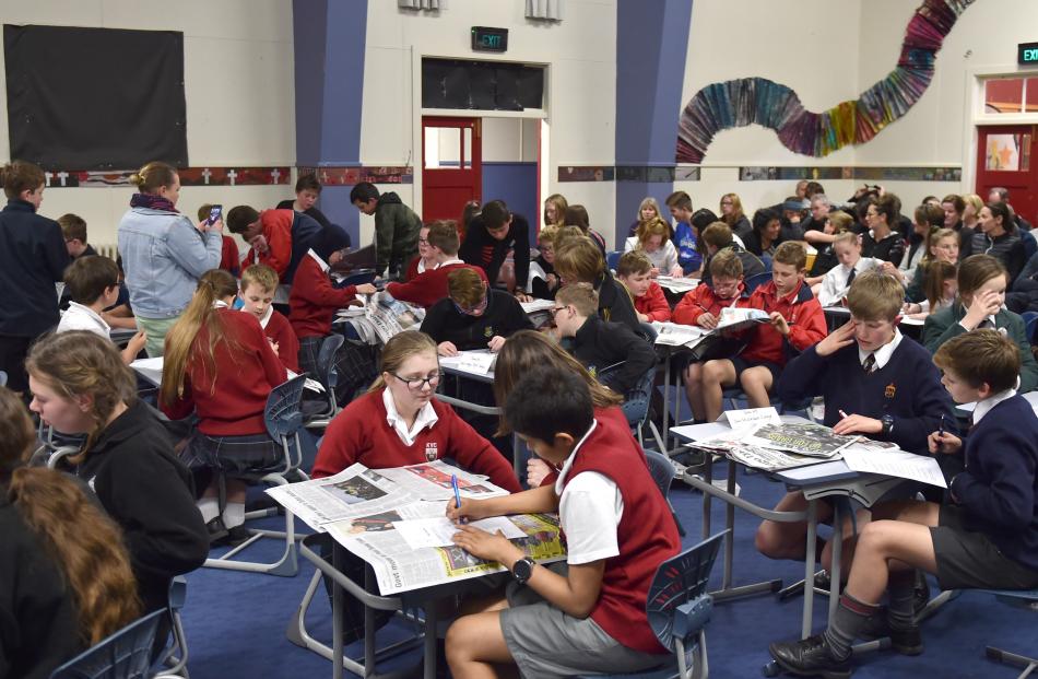 Competitors get down to business in the Otago Daily Times Extra! current events quiz at Bathgate Park School, in Dunedin, last night. Photos: Gregor Richardson