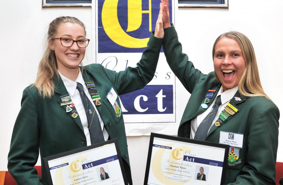 East Otago High School pupils Lauren Keen (left) and Hannah Paton celebrate their successes....