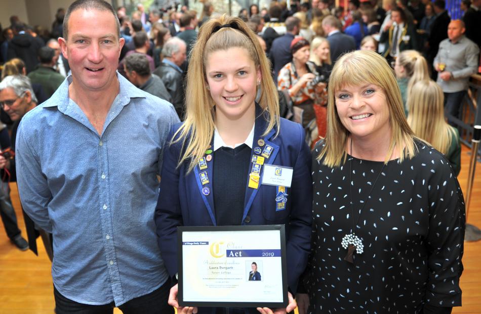Parents Alister and Sharyn Bungard pose with their daughter, Laura, from Taieri College. Photo:...