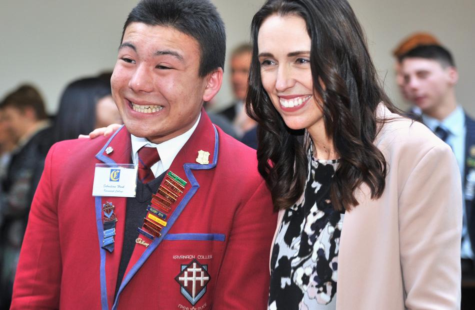 Kavanagh College pupil Sebastian Hook cracks a smile while having his picture taken with Prime...