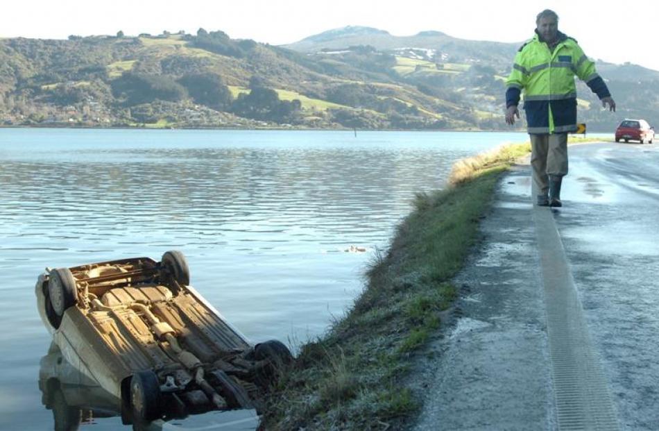 Senior Constable Lox Kellas comes to grips with a slippery Portobello Rd after a teenage driver...