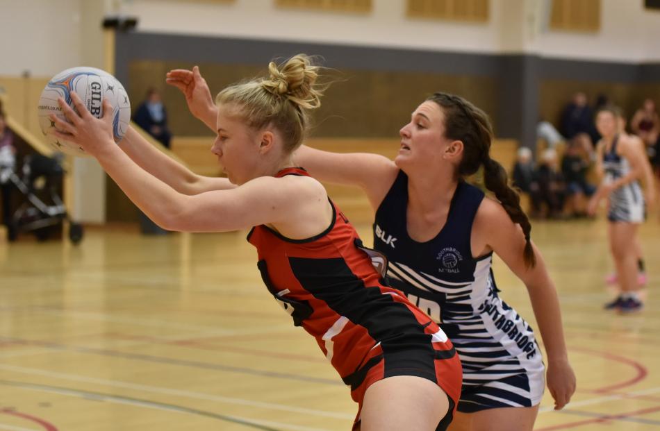 Lincoln A's Madeline Walker grabs the ball before Southbridge A's wing defence Beth Williamson during Lincoln's 71-37 Selwyn premier netball win at Lincoln Events Centre, on Saturday. Photo: Karen Casey.