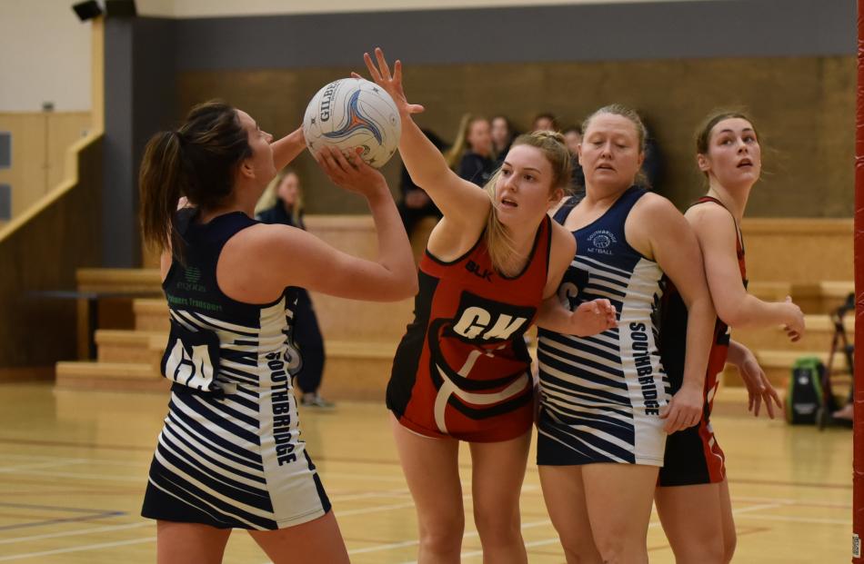 Southbridge A goal attack Tracey Stone is guarded by Lincoln A goal keep Isla McKillop as Megan Perhouse and Janie Watkins look for position. Photo: Karen Casey.