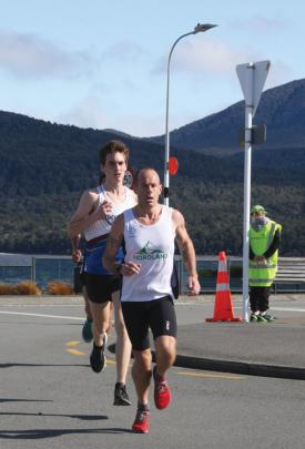 Fiordland Athletic Club Captain and Masters athlete Dwight Grieve in the lead at the lakefront...